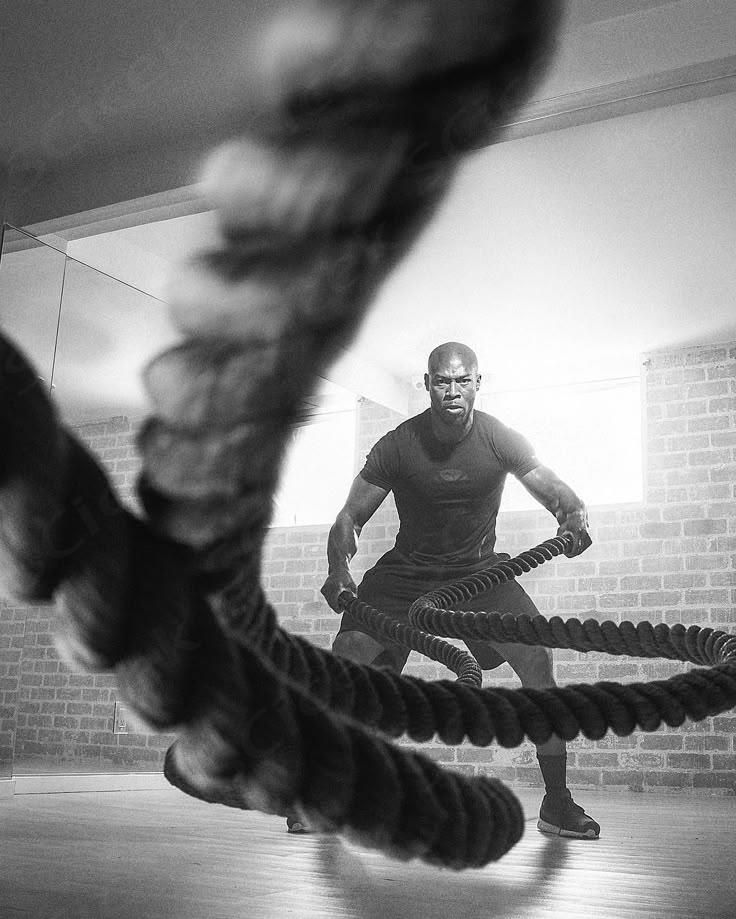 Athlete training with battle ropes
